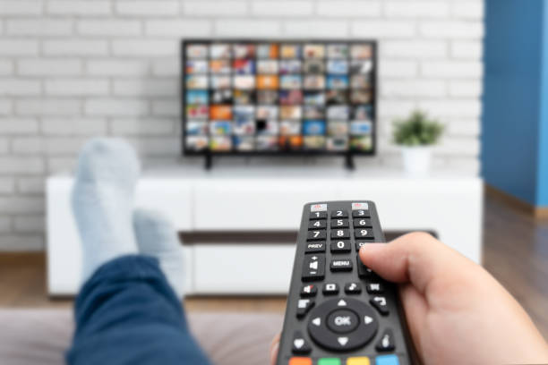 Man watching TV, smarters pro iptv box australia iptv australia